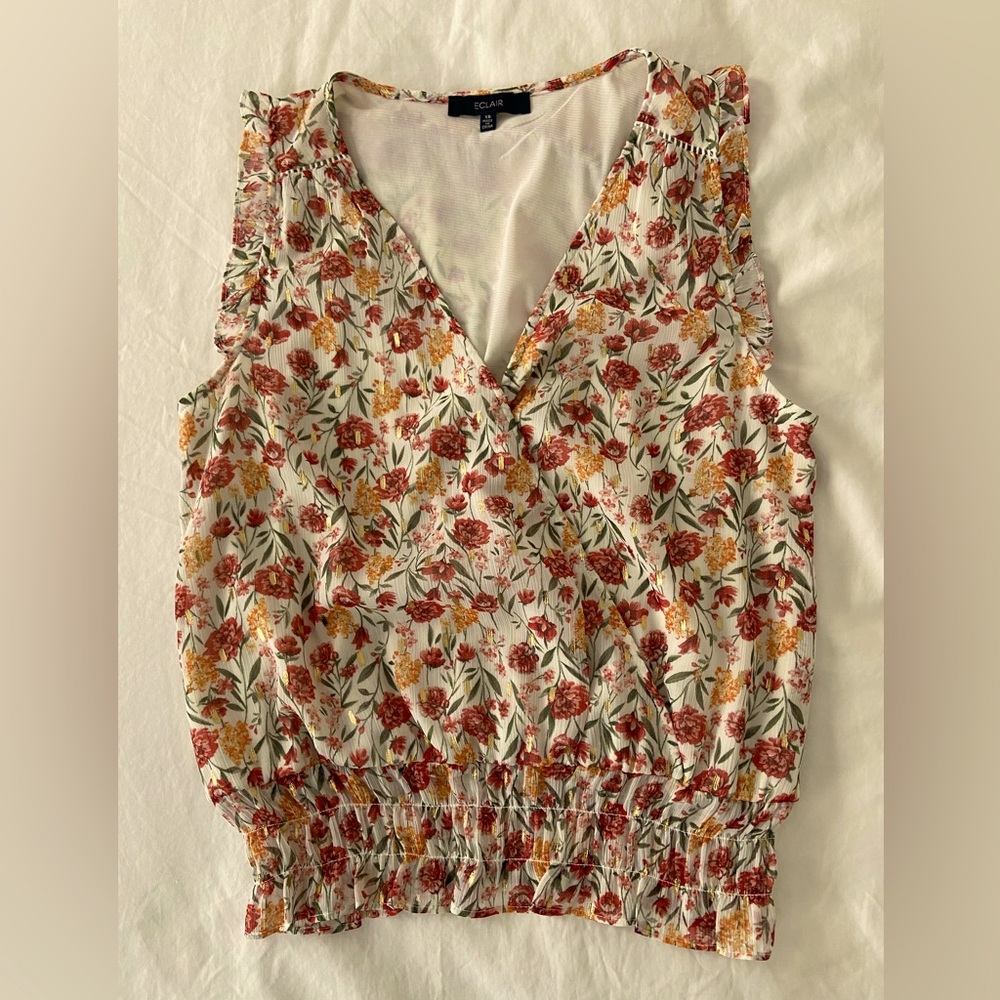 Smocked-waist floral top with gold paint details. Eclair brand, XS, like new.